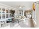 Relaxing sunroom with comfy seating and large windows at 39320 Harbor Hills Blvd, Lady Lake, FL 32159