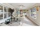 Bright sunroom with a sofa and plenty of natural light at 39320 Harbor Hills Blvd, Lady Lake, FL 32159