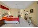Spacious bedroom with an exercise bike, large bed, and ample storage at 5509 Grove Mnr, Lady Lake, FL 32159