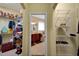 Walk-in closet with built-in shelving, and view of the bathroom at 5509 Grove Mnr, Lady Lake, FL 32159