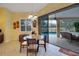 Breakfast nook with glass-top table, view of pool, and tile floors at 5509 Grove Mnr, Lady Lake, FL 32159