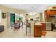 Kitchen with wood cabinets, breakfast bar, and adjacent dining area at 5509 Grove Mnr, Lady Lake, FL 32159