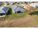 Aerial view showing house, backyard, and surrounding area at 5717 Illumination Ln, Leesburg, FL 34748