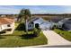 Single-Gathering home with a two-car garage and a large backyard at 5717 Illumination Ln, Leesburg, FL 34748