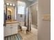 Clean bathroom with a shower/tub combo and updated vanity at 5717 Illumination Ln, Leesburg, FL 34748