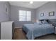 Comfortable bedroom with a queen-size bed and ample closet space at 5717 Illumination Ln, Leesburg, FL 34748