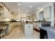 Spacious kitchen with island, ample cabinetry, and granite countertops at 5717 Illumination Ln, Leesburg, FL 34748