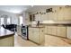 Well-equipped kitchen with an island and ample counter space at 5717 Illumination Ln, Leesburg, FL 34748