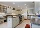 Bright kitchen with stainless steel appliances and granite countertops at 5717 Illumination Ln, Leesburg, FL 34748