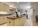 Island kitchen features granite countertops and breakfast bar at 5717 Illumination Ln, Leesburg, FL 34748