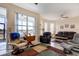 Relaxing living room with lake view and comfortable seating at 5717 Illumination Ln, Leesburg, FL 34748