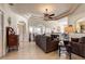 Spacious living room with a comfortable couch and high ceilings at 5717 Illumination Ln, Leesburg, FL 34748