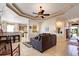 Open living room and kitchen with neutral color scheme at 5717 Illumination Ln, Leesburg, FL 34748