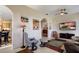 Open living room with hardwood floors and cozy seating area at 5717 Illumination Ln, Leesburg, FL 34748
