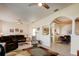 Spacious living area with tile floors and comfortable furniture at 5717 Illumination Ln, Leesburg, FL 34748