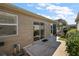 Backyard patio with sliding glass doors and landscaping at 8173 Se 169Th Palownia Loop, The Villages, FL 32162