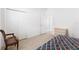 Bedroom with wood dresser and adjacent bathroom at 893 Parrish Pl, The Villages, FL 32163
