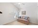 Bright bedroom with a comfy couch and plenty of natural light at 893 Parrish Pl, The Villages, FL 32163
