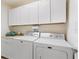 Laundry room with Maytag washer and dryer, plus cabinets at 893 Parrish Pl, The Villages, FL 32163