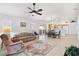 Open living area with kitchen, dining, and living room at 893 Parrish Pl, The Villages, FL 32163