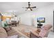 Open concept living area with views into the kitchen and dining area at 893 Parrish Pl, The Villages, FL 32163