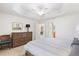 Spacious main bedroom with dresser, carpet, and access to bathroom at 893 Parrish Pl, The Villages, FL 32163