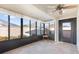 Sunroom with multiple windows and ceiling fan at 893 Parrish Pl, The Villages, FL 32163