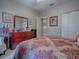 Bright bedroom with a dresser and comfortable seating at 9216 Se 125Th Loop, Summerfield, FL 34491