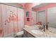 Charming bathroom with flamingo-themed decor at 9811 Pepper Tree Pl, Wildwood, FL 34785