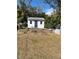 Backyard with detached shed and grassy area at 100 W Myrtle St, Howey In The Hills, FL 34737