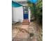 Backyard with flagstone patio, wooden dining set, and bamboo plants at 100 W Myrtle St, Howey In The Hills, FL 34737