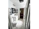 Bright bathroom with white vanity and hexagon tile floors at 100 W Myrtle St, Howey In The Hills, FL 34737