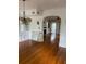 Bright dining room with hardwood floors and built-in shelving at 100 W Myrtle St, Howey In The Hills, FL 34737
