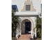 Stylish front entrance featuring a blue door and arched entryway at 100 W Myrtle St, Howey In The Hills, FL 34737