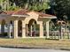 Large gazebo with picnic tables near playground and lake at 100 W Myrtle St, Howey In The Hills, FL 34737