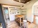 Kitchen with butcher block island, open shelving, and stainless steel appliances at 100 W Myrtle St, Howey In The Hills, FL 34737