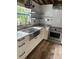 Modern farmhouse kitchen featuring stainless steel appliances and granite countertops at 100 W Myrtle St, Howey In The Hills, FL 34737