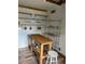 Kitchen with butcher block island, open shelving and stainless steel appliances at 100 W Myrtle St, Howey In The Hills, FL 34737
