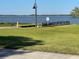 Peaceful lakeside park with a pier and grassy area at 100 W Myrtle St, Howey In The Hills, FL 34737