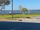 Scenic view of a lake with a walking path and no parking sign at 100 W Myrtle St, Howey In The Hills, FL 34737