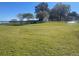 Large grassy park area with lake access, gazebos, and a pier at 100 W Myrtle St, Howey In The Hills, FL 34737