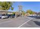 View of the covered parking area and community pool at 1112 W Main St # A7, Leesburg, FL 34748