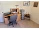 Home office features a desk, chair, and storage at 1270 Addison Ave, The Villages, FL 32162