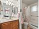 Bathroom with walk-in shower and updated vanity at 1310 Moray Ct, Leesburg, FL 34788
