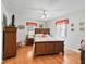 Main bedroom with wood floors and double bed at 1310 Moray Ct, Leesburg, FL 34788
