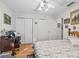 Bedroom with wood floors and ample closet space at 1310 Moray Ct, Leesburg, FL 34788
