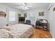 Bedroom with a home office and wood floors at 1310 Moray Ct, Leesburg, FL 34788