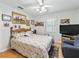 Bedroom with wood floors and ceiling fan at 1310 Moray Ct, Leesburg, FL 34788
