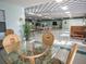 Spacious community room with tables, chairs, and a piano at 1310 Moray Ct, Leesburg, FL 34788
