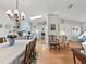 Bright dining room features a table with lace tablecloth and chandelier at 1310 Moray Ct, Leesburg, FL 34788